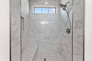 Shower, hair dryer, towels, toilet paper