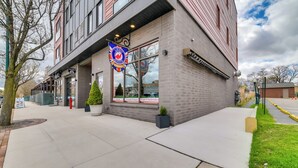 A building with a brick facade, large windows, and a sign indicating it is a restaurant. - Walk Everywhere! Central Traverse City Condo (Traverse City)