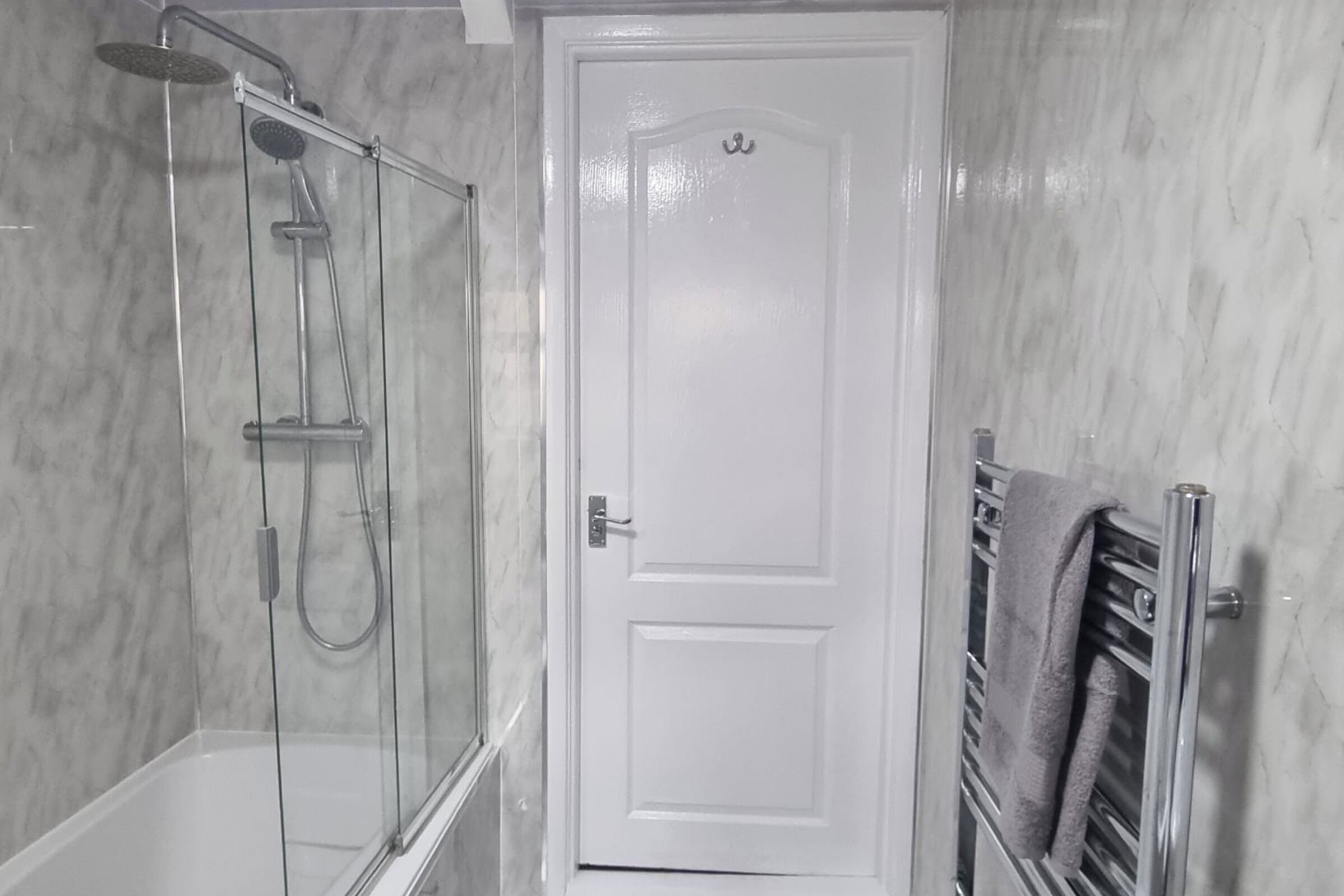 Combined shower/bathtub, deep-soaking bathtub, towels