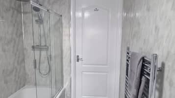 Combined shower/bathtub, deep-soaking bathtub, towels