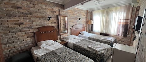 Standard Triple Room, Sea View | Desk, laptop workspace, soundproofing, free WiFi