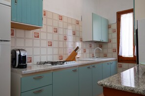 Fridge, oven, coffee/tea maker, cookware/dishes/utensils