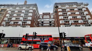 A multi-story building with a modern architectural design, featuring balconies and large windows. - The Princes Residences (London)