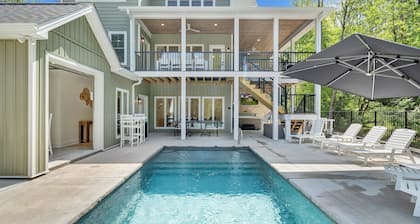 Whispering Pines Estate, Waterfront Luxury w/ Covered Verandas + Heated Salt Pool, Hot Tub, Dock!