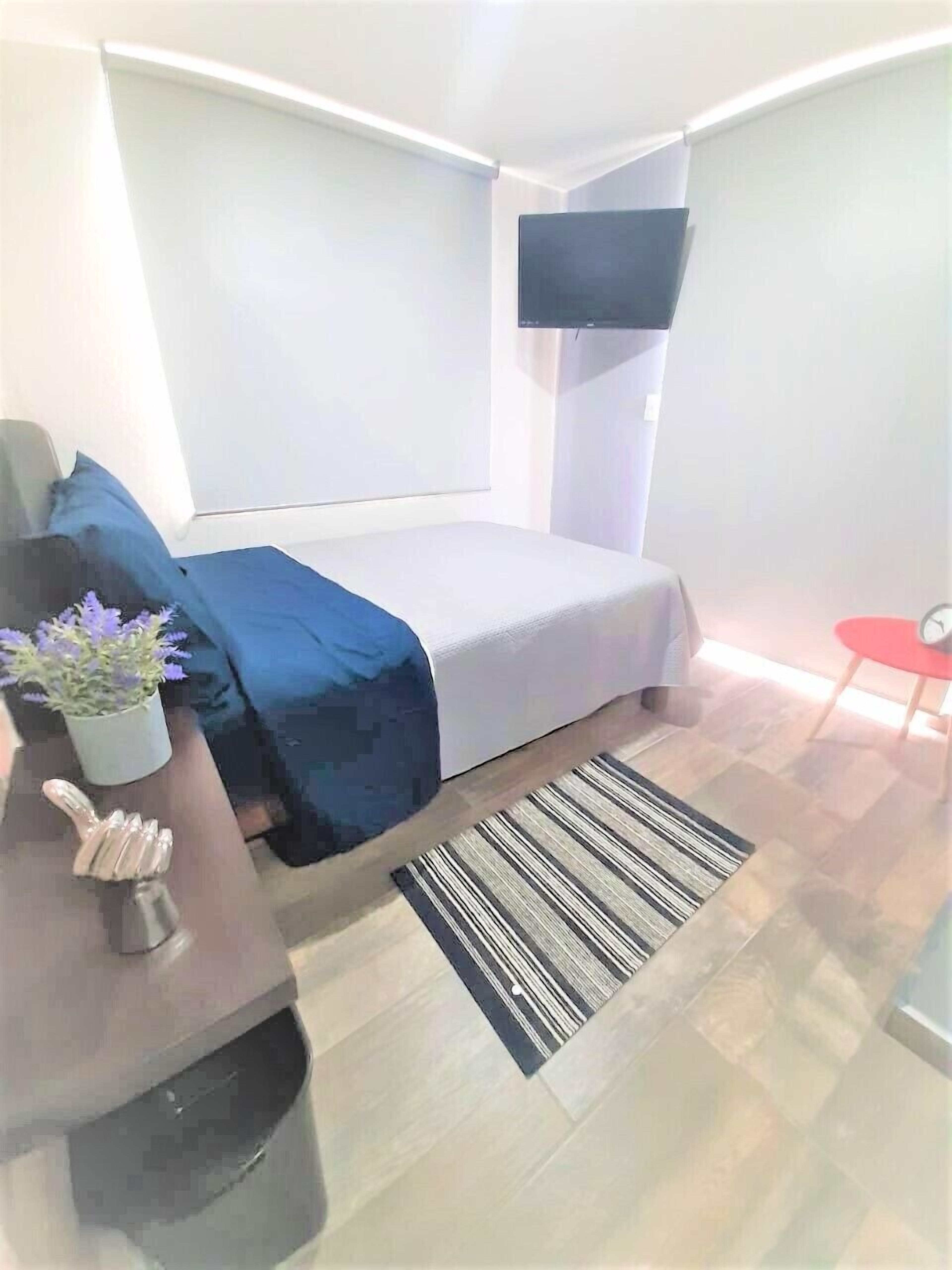 Deluxe Room, Balcony, City View | In-room safe, individually decorated, desk, laptop workspace