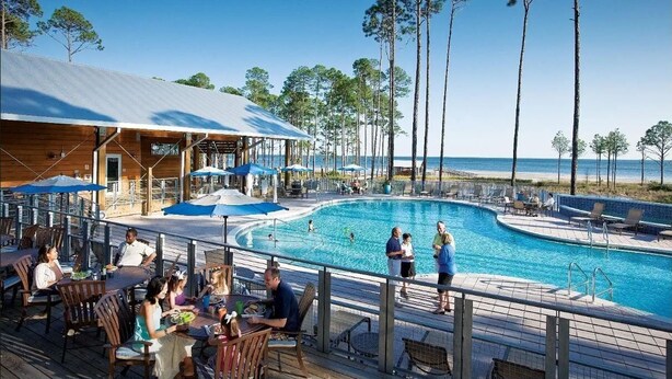 A poolside area with a covered seating area, pool, and beach view. - North Firefly - Resort Pool, 2-min. walk to Private Beach! (Saint Teresa)