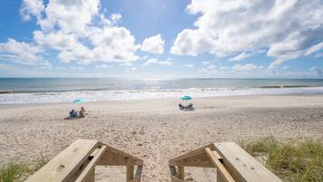 On the beach, sun-loungers, beach towels