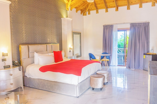 Deluxe Room, 1 King Bed, Garden View | In-room safe, individually decorated, individually furnished