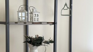 A bunk bed with a metal frame, a shelf with a potted plant, and two white lanterns. - 2 Bedroom Downtown Apt Walkable Safe Clean (Pittsburgh)
