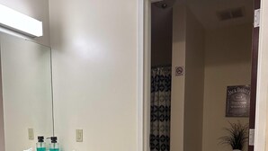 A bathroom with a sink, mirror, and toiletries. - 2 Bedroom Downtown Apt Walkable Safe Clean (Pittsburgh)