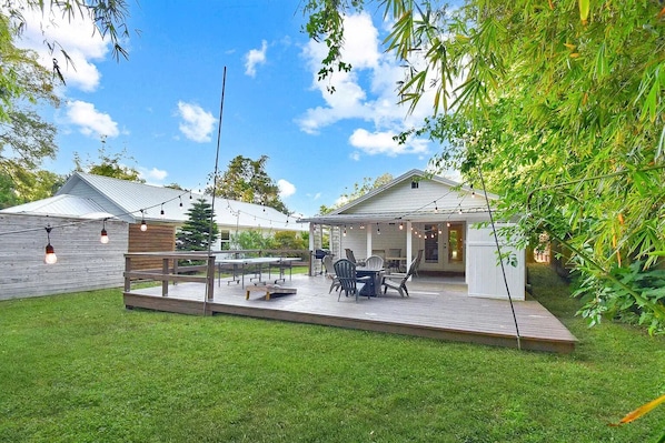 Enjoy al fresco dining on the patio, surrounded by lush greenery and a tranquil atmosphere.