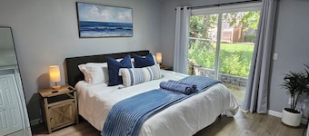 Cozy Home Near DOWNTOWN w/ HOT TUB, Fire Pit, Bikes, King Bed, and Full Kitchen