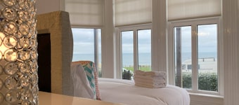 Spacious dog-friendly beachfront home, ideal for beach, pub & town. Terrace, garden & fire pit .
