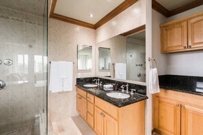 A modern bathroom with two sinks, a large mirror, and wooden cabinets. - Ocean View Retreat- 4 Blocks From Solana Beach (Solana Beach)