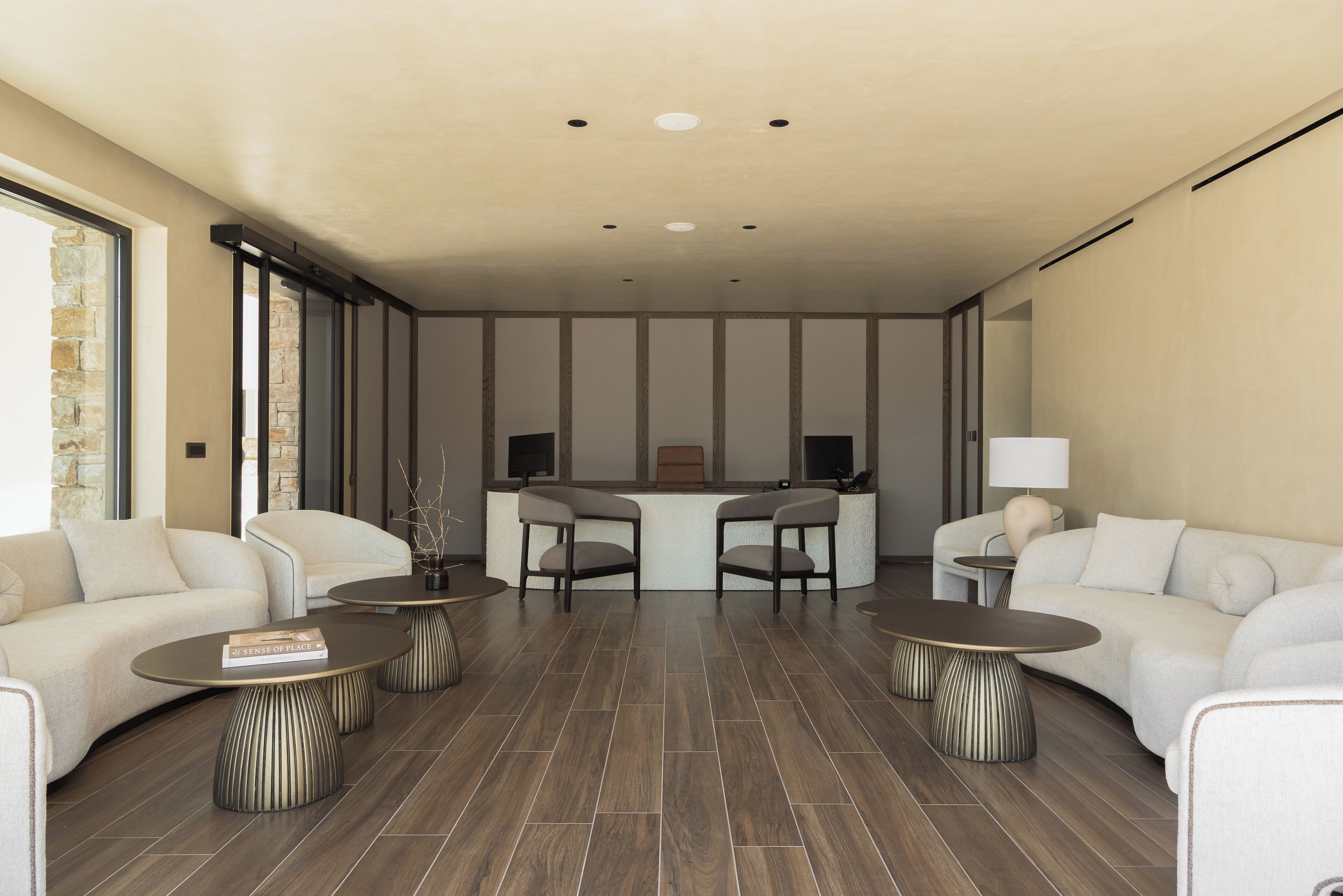 A modern living room with two sofas, a coffee table, and a TV stand.