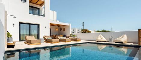 Seasonal outdoor pool, pool umbrellas, pool loungers