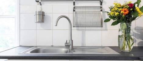 Fridge, toaster, cookware/dishes/utensils