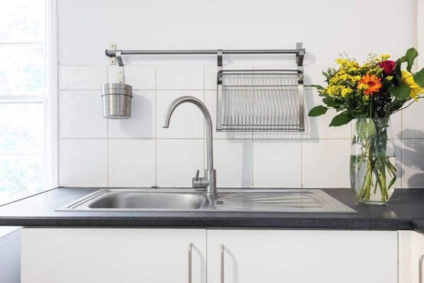 Fridge, toaster, cookware/dishes/utensils