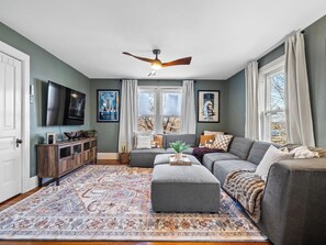 Smart TV, fireplace, books, stereo