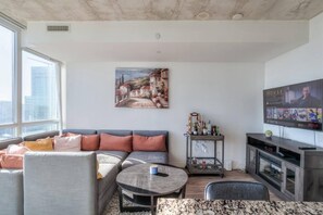 Deluxe Condo | Living area | 50-inch Smart TV with digital channels, Netflix, streaming services - Waterfront Yonge Apartments (Toronto)