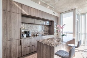 Deluxe Condo | Private kitchen | Full-size fridge, microwave, stovetop, cleaning supplies - Waterfront Yonge Apartments (Toronto)