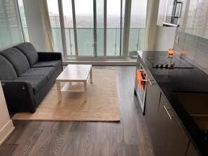 Classic Condo | Private kitchen | Full-size fridge, microwave, stovetop, cleaning supplies - Waterfront Yonge Apartments (Toronto)