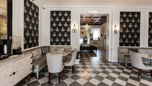 A spacious living area with a checkered floor, a sofa set, and a chandelier. - San Diego | San Diego Zoo Trip | Hot Tub & Rooftop Deck (San Diego)