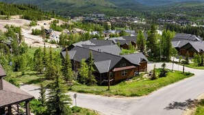 A residential area with houses, roads, and a mountainous backdrop. - 40 Reunion Ct w/ private hot tub (Fraser)