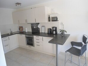 Réfrigérateur, four, plaque de cuisson, lave-vaisselle