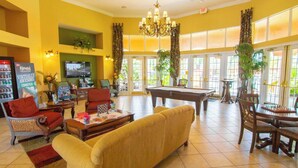 A spacious lobby with a pool table, comfortable seating, and a television. - Lesa's Solana Resort Vacation Home (Davenport)