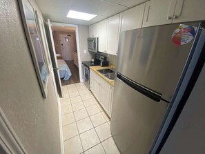 Microwave, coffee/tea maker, cookware/dishes/utensils