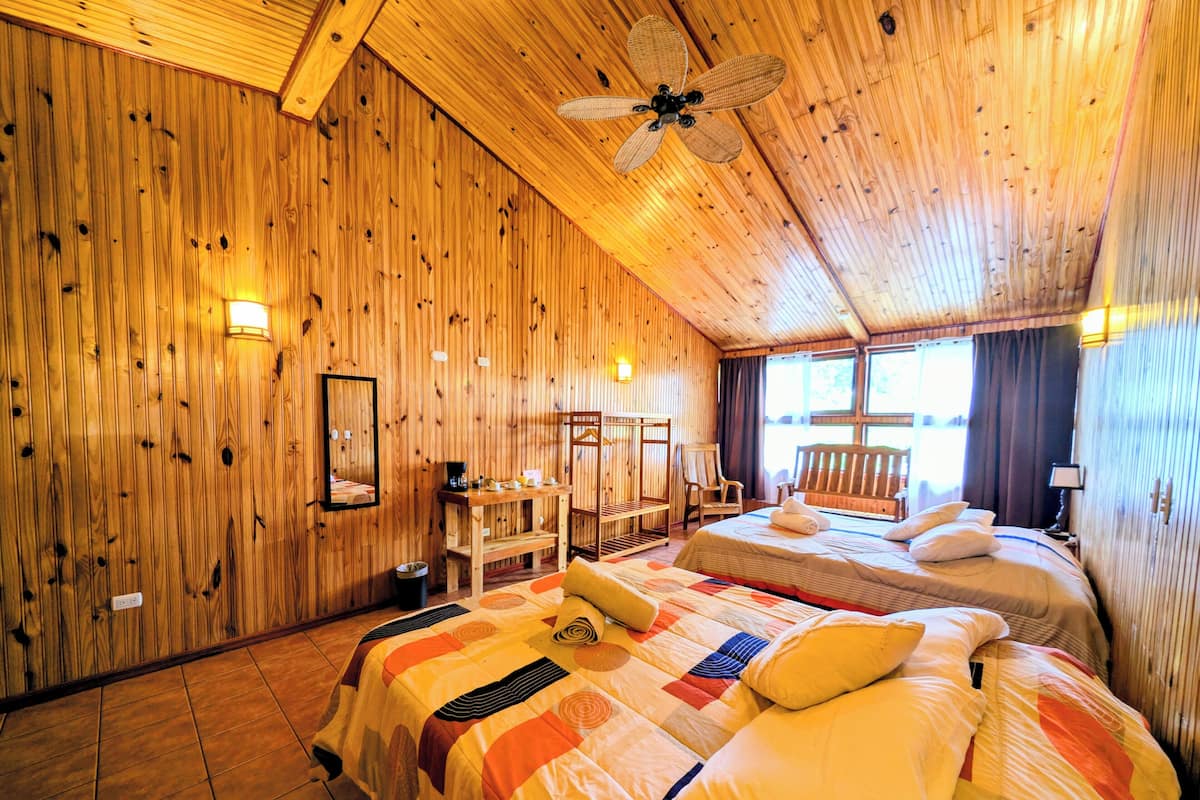 Superior Quadruple Room, Garden View | Hypo-allergenic bedding, down duvets, minibar, iron/ironing board