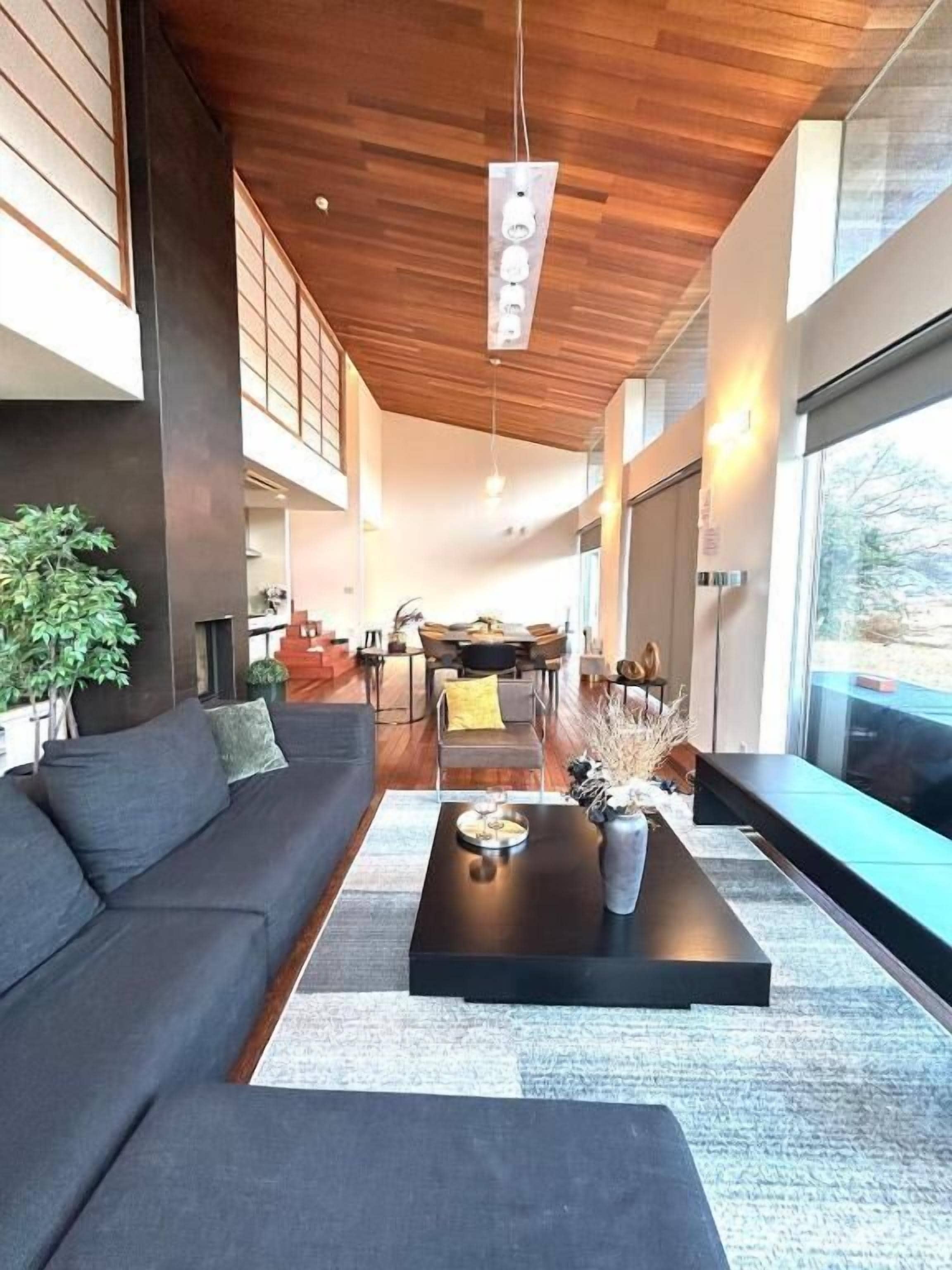 Design House | Living area | 200-inch flat-screen TV with digital channels, streaming services