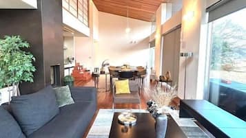 Design House | Living area | 200-inch flat-screen TV with digital channels, streaming services