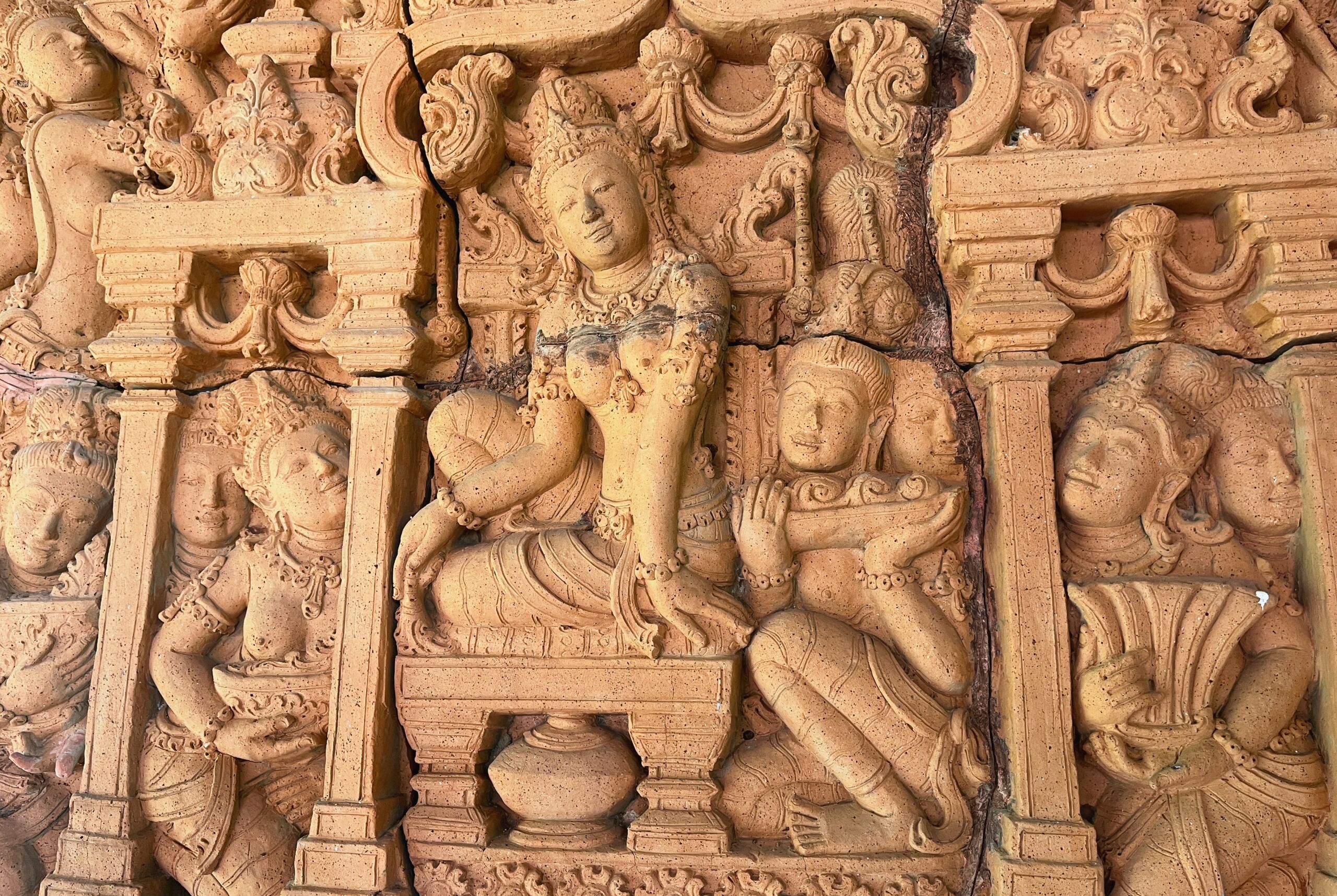 A detailed stone carving with intricate designs and figures.