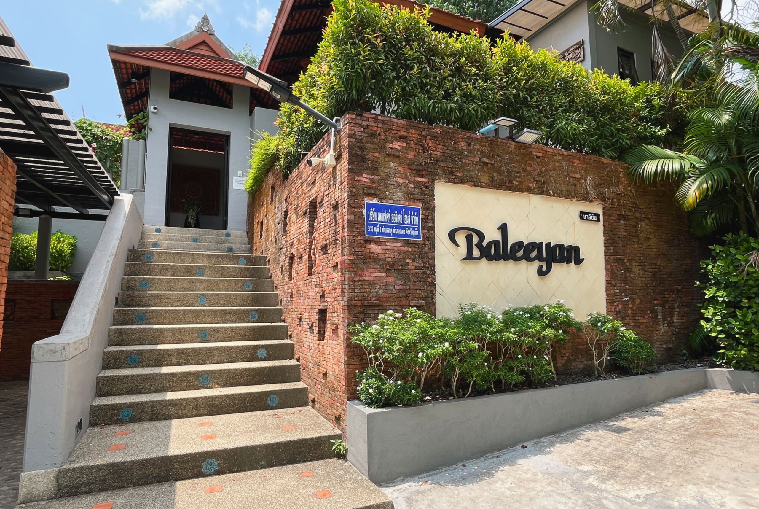 A staircase leading to a building with a sign reading "Balegan".