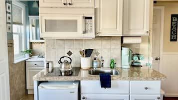 Fridge, microwave, stovetop, coffee/tea maker