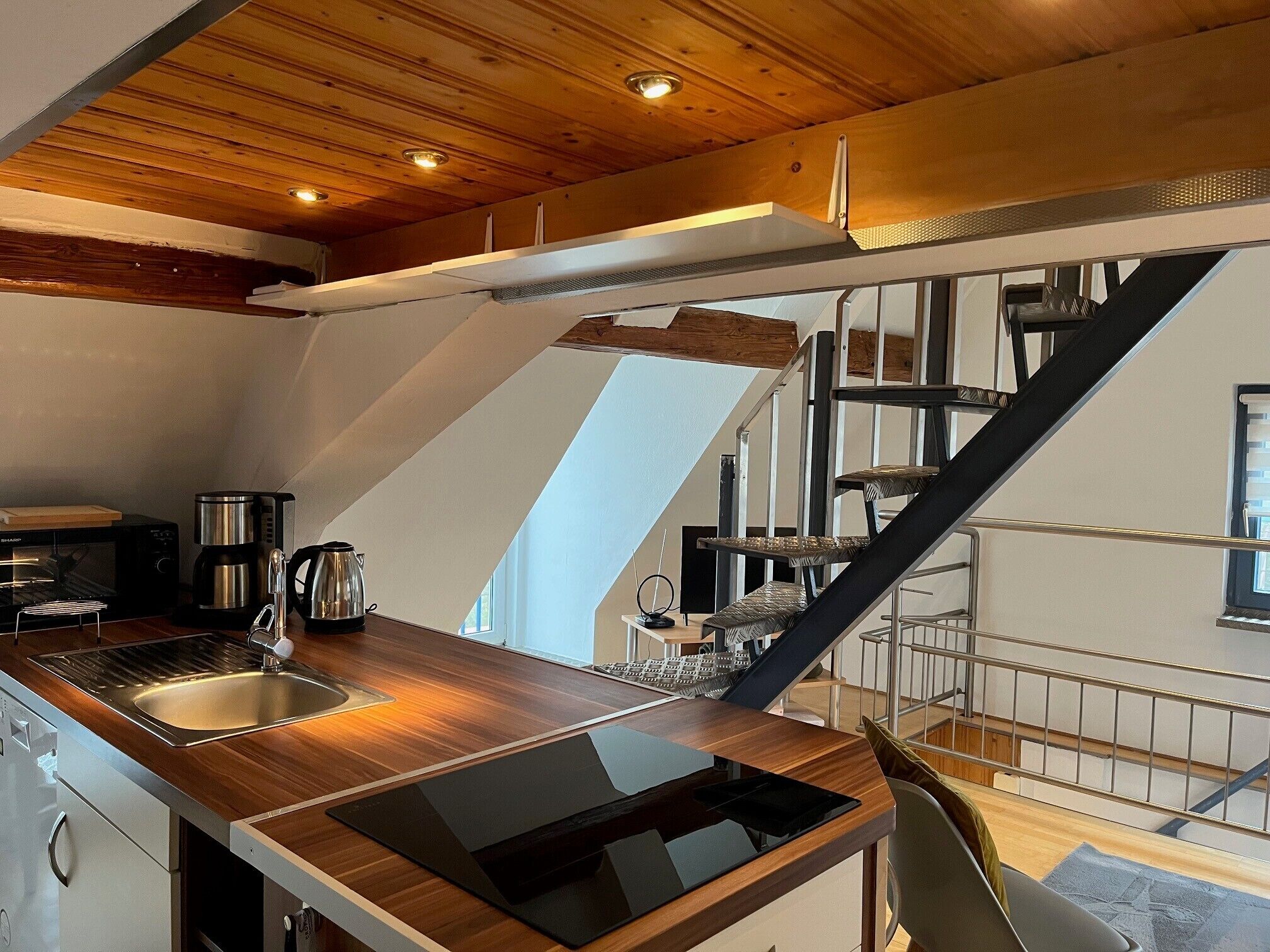 Fridge, stovetop, dishwasher, coffee/tea maker