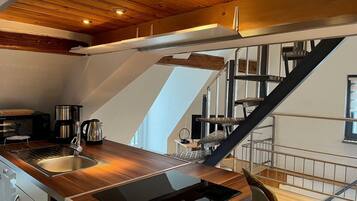 Fridge, stovetop, dishwasher, coffee/tea maker