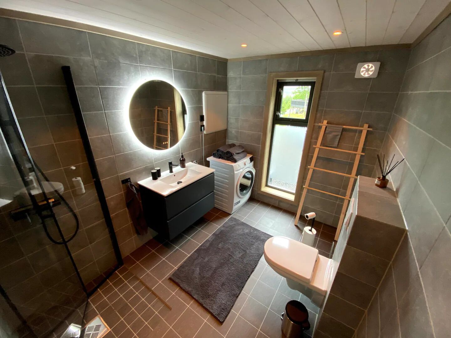 Shower, hair dryer, soap, toilet paper