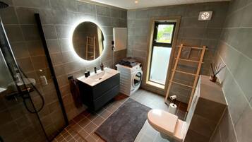 Shower, hair dryer, soap, toilet paper