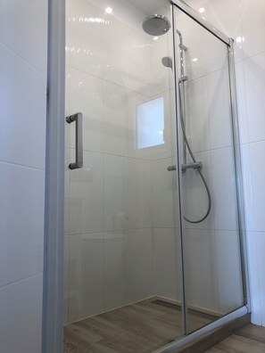 Shower, hair dryer, towels, soap