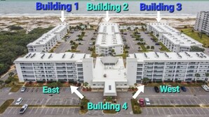 A large, multi-story building with four labeled sections: Building 1, Building 2, Building 3, and Building 4. It features a central entrance with a parking lot in front. - Flash Sale. Direct Gulf Front 1/1 Sleeps 6 (Gulf Shores)