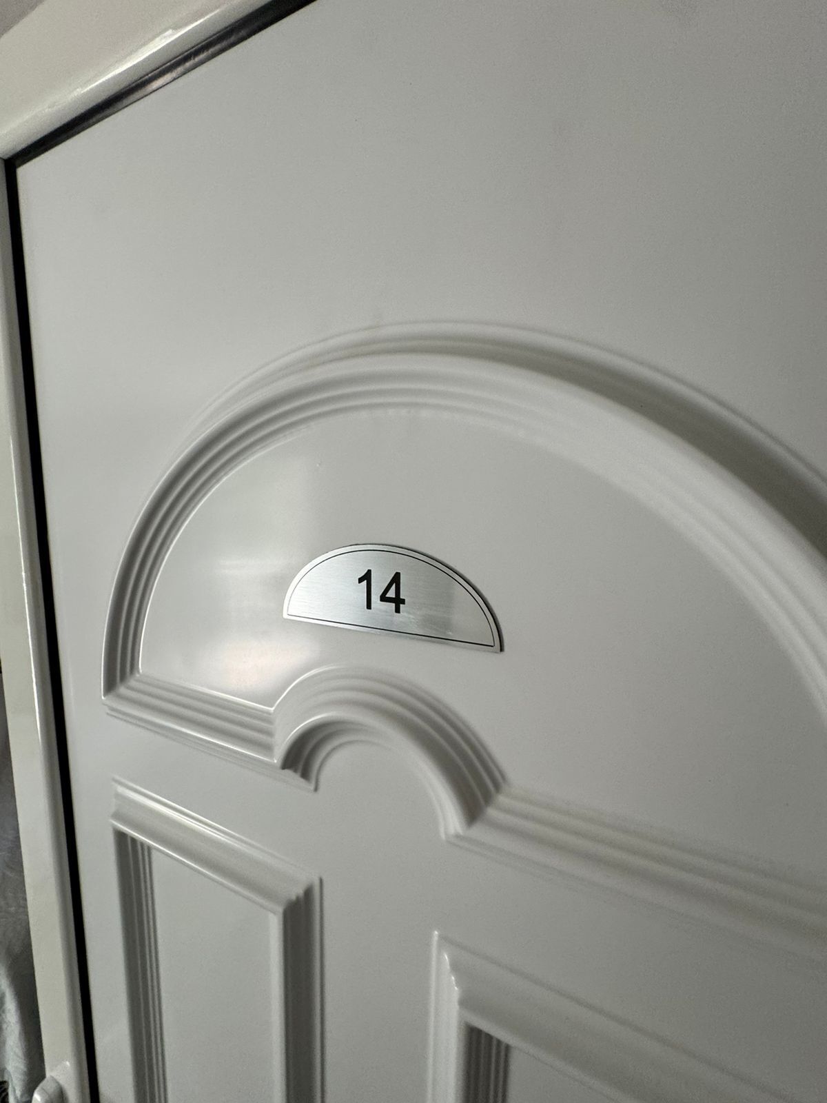 A door with a number plate labeled "14".