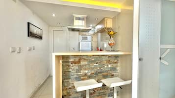 Superior Apartment, Garden View | Private kitchen | Fridge, microwave, stovetop, dishwasher