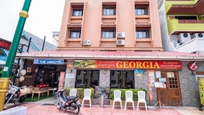 A building with a sign for 'The Minotel' and 'Georgia Georgian Cuisine'. - Minotel Patong (Patong)
