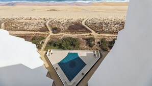 A rooftop pool with a view of the beach and ocean. - Includes Xplorie Activities & Linens. PYRAMID 1BR-OF condo w/outdoor pool. (Ocean City)