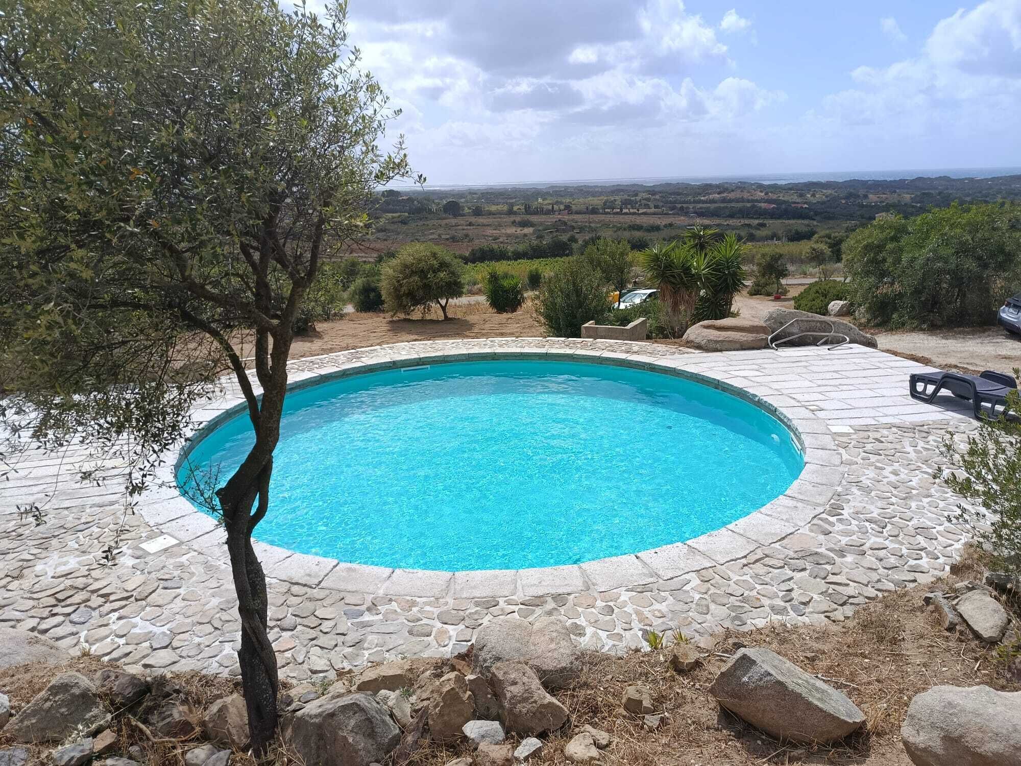 Seasonal outdoor pool, pool umbrellas, pool loungers