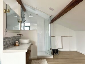 Shower, hair dryer, towels, soap