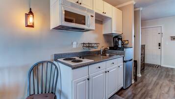 Fridge, microwave, stovetop, coffee/tea maker